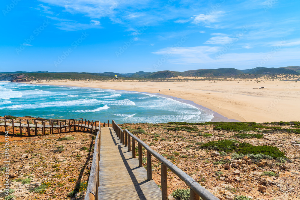 Wooden walkway to beautiful Praia da Bordeira beach, popular place to do kite surfing, Algarve, Portugal Wooden walkway to beautiful Praia da Bordeira beach, popular place to do kite surfing, Algarve, Portugal