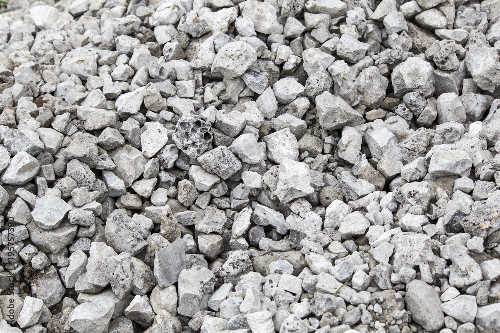Crushed stone, pile of stones. Gray background Crushed stone, pile of stones. Gray background