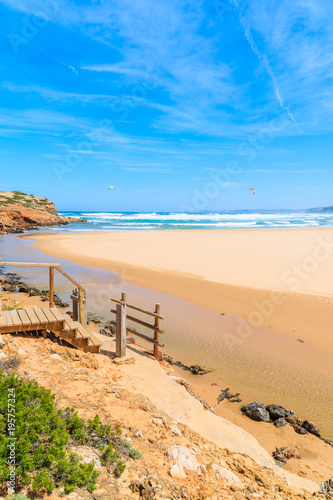 Wooden walkway to beautiful Praia da Bordeira beach  popular place to do kite surfing  Algarve  Portugal