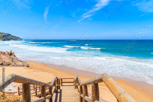 Walkway to Amado beach with beautiful sea waves  Algarve  Portugal