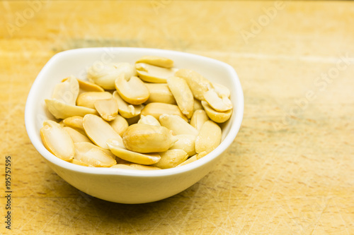 Bowl with shelled peanuts.