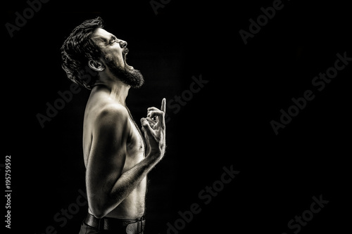 emotionally expressive photograph of a screaming bearded man, an angry pain cry black and white photo.