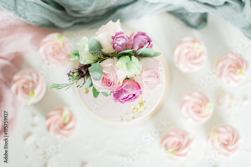 Wedding cake decorated with roses and flowers. Top view, flat way