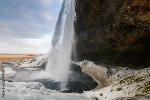 behind seljalandsfoss waterfall in Iceland