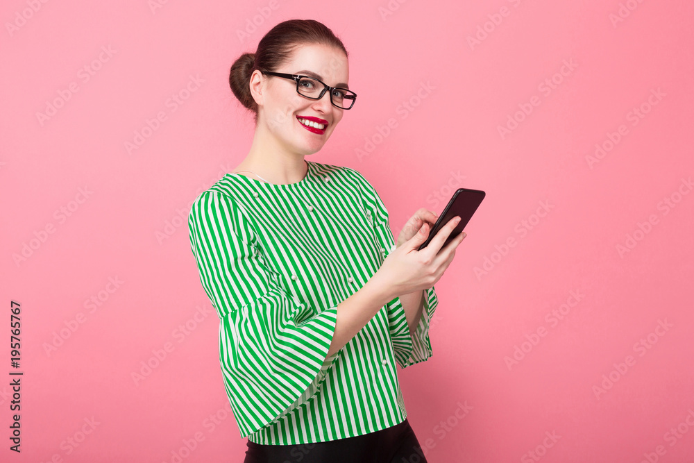 Businesswoman with hair bun and cellphone Businesswoman with hair bun and cellphone