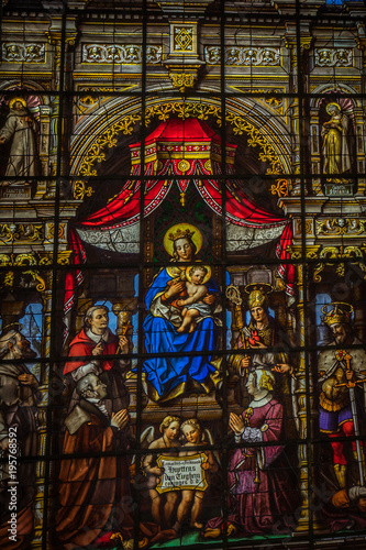 Painted glass with Mary and baby Jesus in the interiors of Saint Nicholas Church  Ghent  Belgium