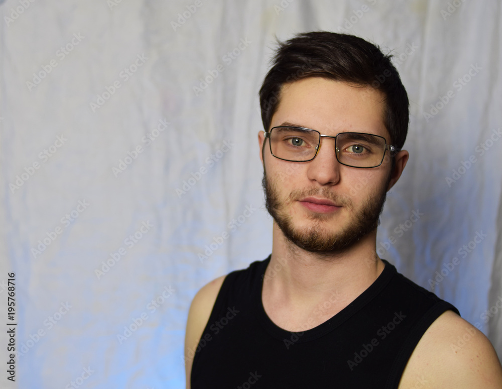Fototapeta premium guy with a beard wearing glasses