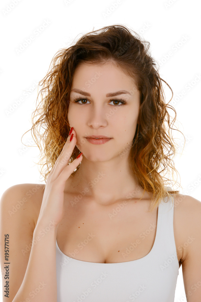 Young woman touching her face Young woman touching her face
