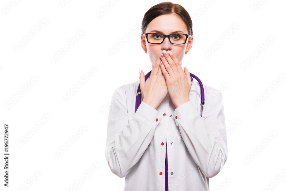 Young beautiful female doctor covering ears with her hands as need of silence medical secret concept on white background Young beautiful female doctor covering ears with her hands as need of silence medical secret concept on white background