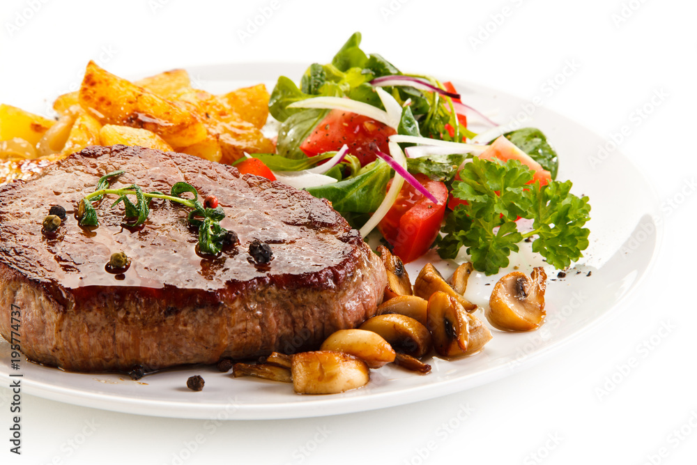 Grilled beefsteak with baked potatoes and vegetables Grilled beefsteak with baked potatoes and vegetables