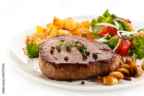 Grilled beefsteak with baked potatoes and vegetables
