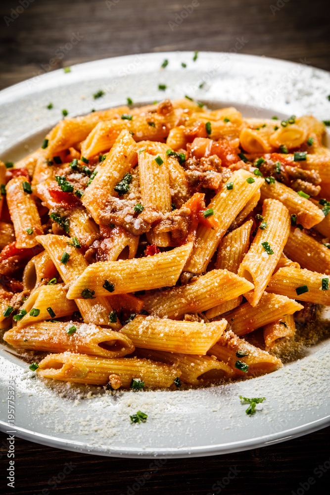 Penne with meat, tomato sauce and vegetables Penne with meat, tomato sauce and vegetables