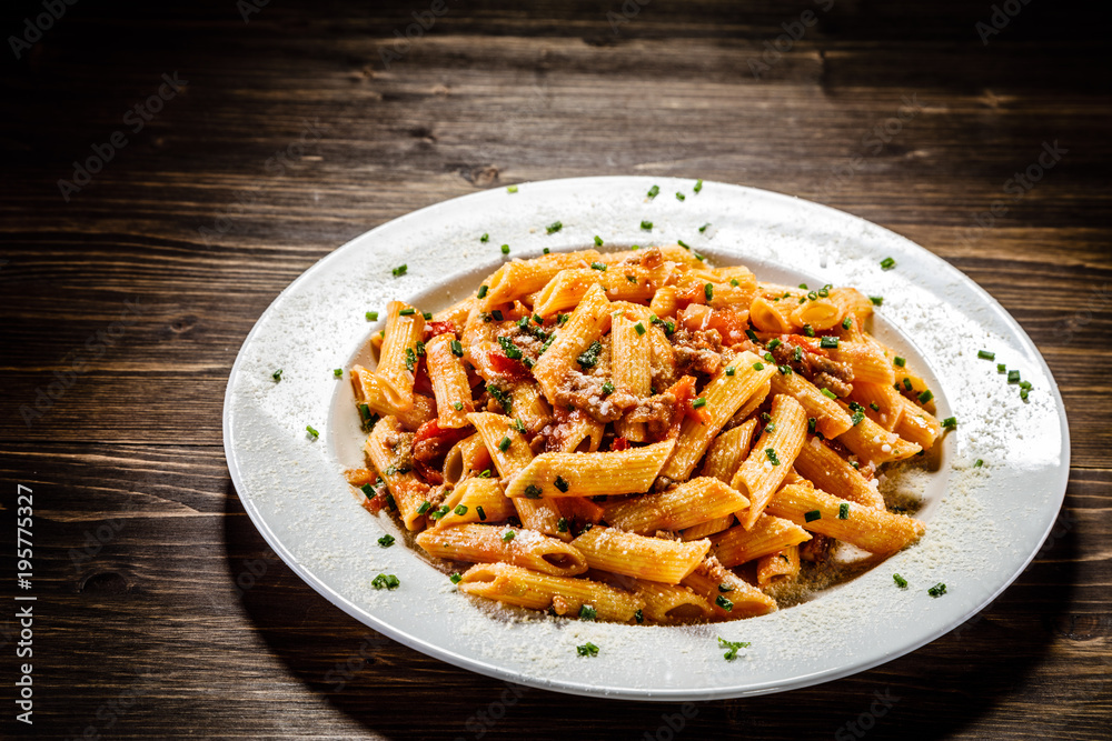 Penne with meat, tomato sauce and vegetables Penne with meat, tomato sauce and vegetables