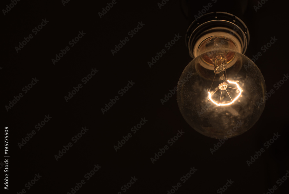 Old Lightbulb on dark background. Idea concept Old Lightbulb on dark background. Idea concept