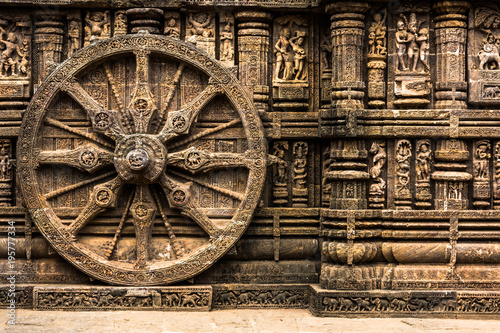 Carved chariot wheel on Konark Sun Temple, Odisha, India photo
