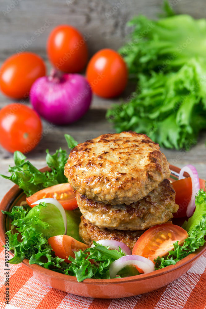 Homemade cutlets with a vegetables on a plate. Homemade cutlets with a vegetables on a plate.
