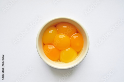 Egg yolks in white bowl