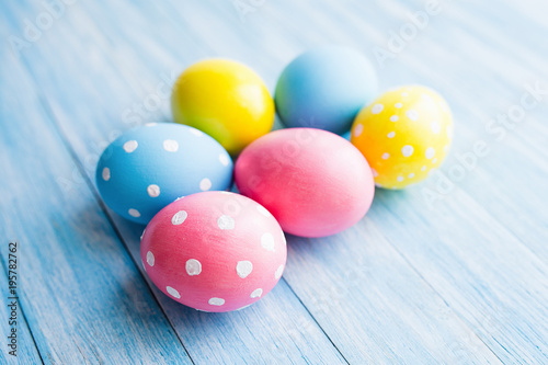 Colorful Easter eggs on blue rustic background