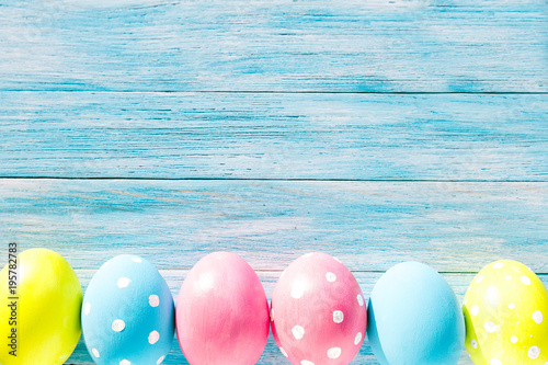 Colorful Easter eggs on blue rustic background