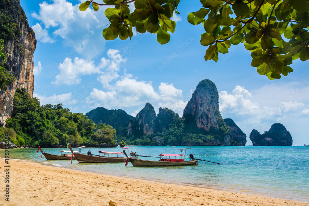 Fototapeta premium Amazing view of beautiful Ao Nang Beach with longtale boats. Location: Krabi Province, Thailand, Andaman Sea. Artistic picture. Beauty world.