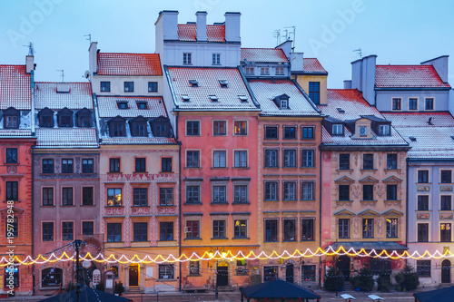 Old Town Market Place with colorful houses during morning blue hour, Warsaw, Poland.