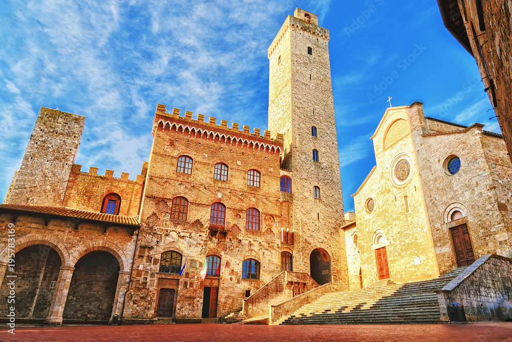 Fototapeta Picturesque View of famous Piazza del Duomo in San Gimignano at sunset, Tuscany, Italy
