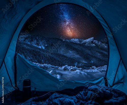 Winter camp at night with s...