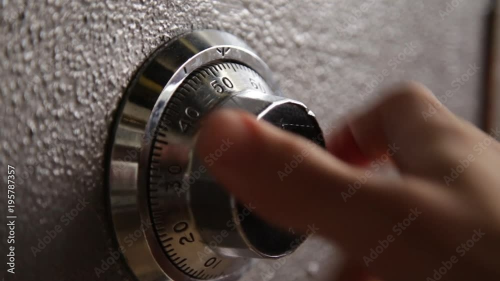 Locking and then opening a safe - close up on dial