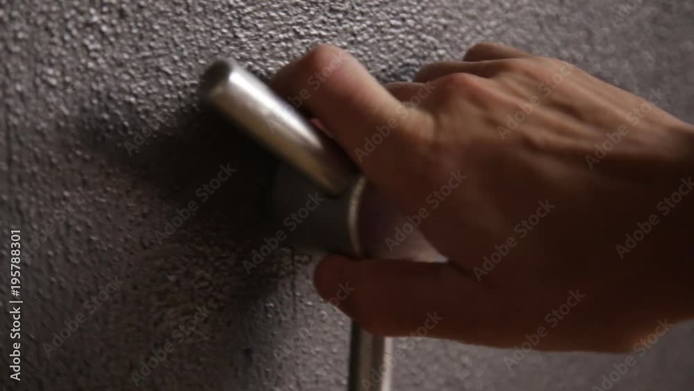 Hand opening and locking a bank safe with handle