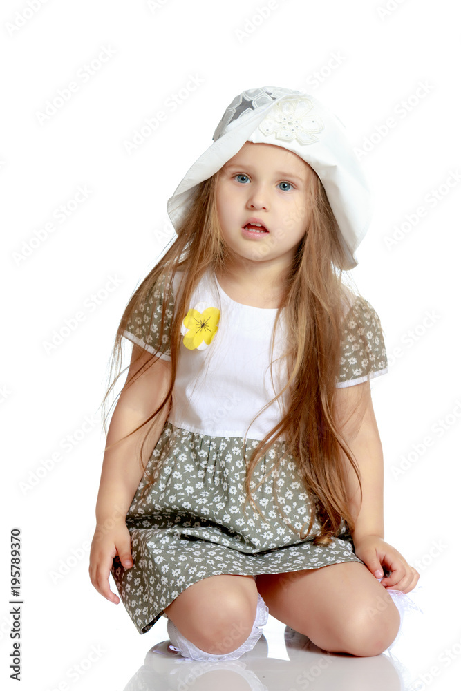 Little girl is sitting on the floor. Little girl is sitting on the floor.