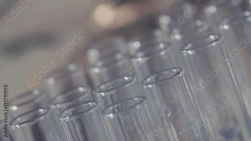 laboratory scientist working with a pipette analyzes and extract the DNA or molecules in the test tubes.on blue background
