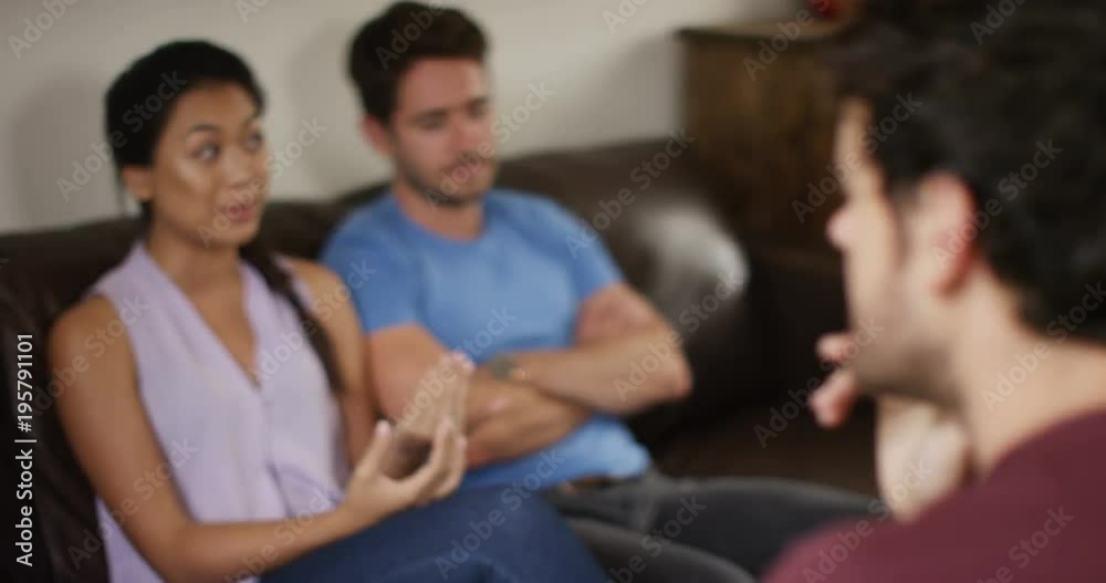 4K Psychologist in therapy with young couple, discussing their relationship problems. Slow motion. 4K Psychologist in therapy with young couple, discussing their relationship problems. Slow motion.
