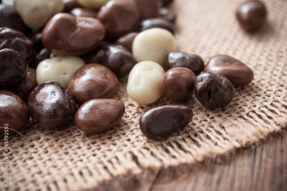closeup of chocolate candies on hessian texture closeup of chocolate candies on hessian texture