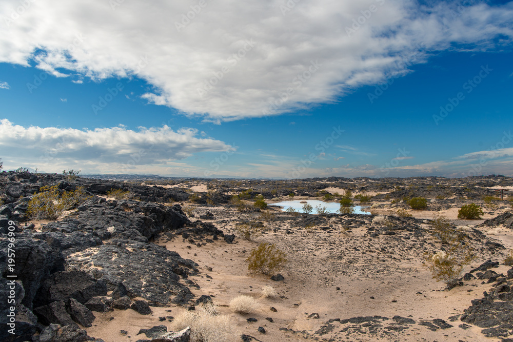 custom made wallpaper toronto digitalBeautiful scene of ancient lava beds along route 66 adjacent to Mojave National preserve along interstate 40 with a rain pond