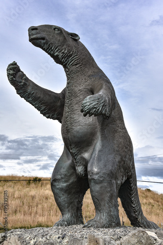 A Milodon statue welcomes visitors to the town of Puerto Natales, Chile photo