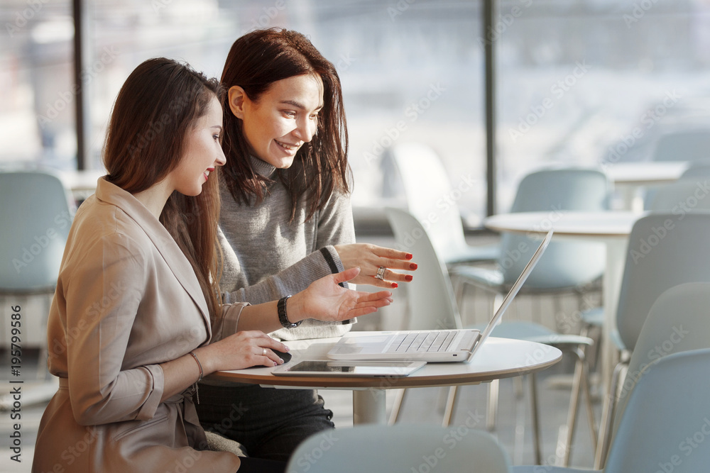 Two business women working at the office Two business women working at the office