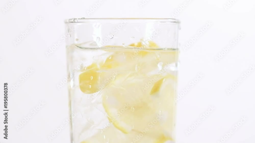 water in a glass with lemon and ice isolated on white background water in a glass with lemon and ice isolated on white background