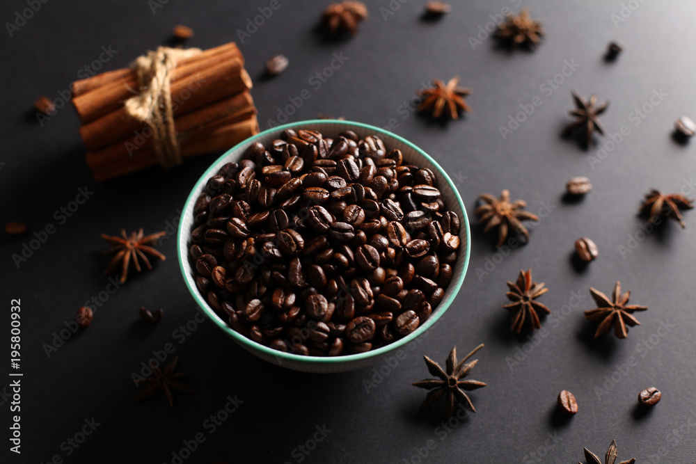 Coffee beans in a bowl with herbs and natural lighting Coffee beans in a bowl with herbs and natural lighting
