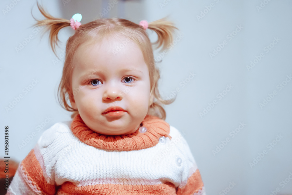 little girl standing at home