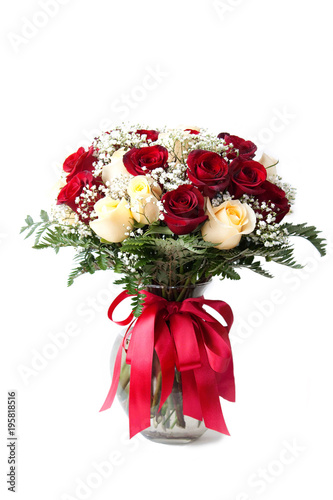 elegant bouquet of red, white roses, decorated with fern leaves, ribbons, flowers clear vase white