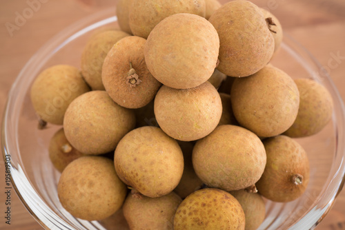 Bowl filled with an heap Dimocarpus Longan fruit