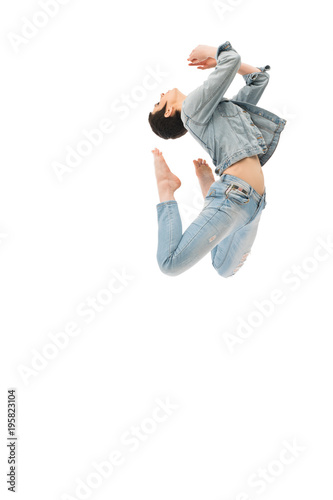 Brunette with shot haircut jumping gracefully