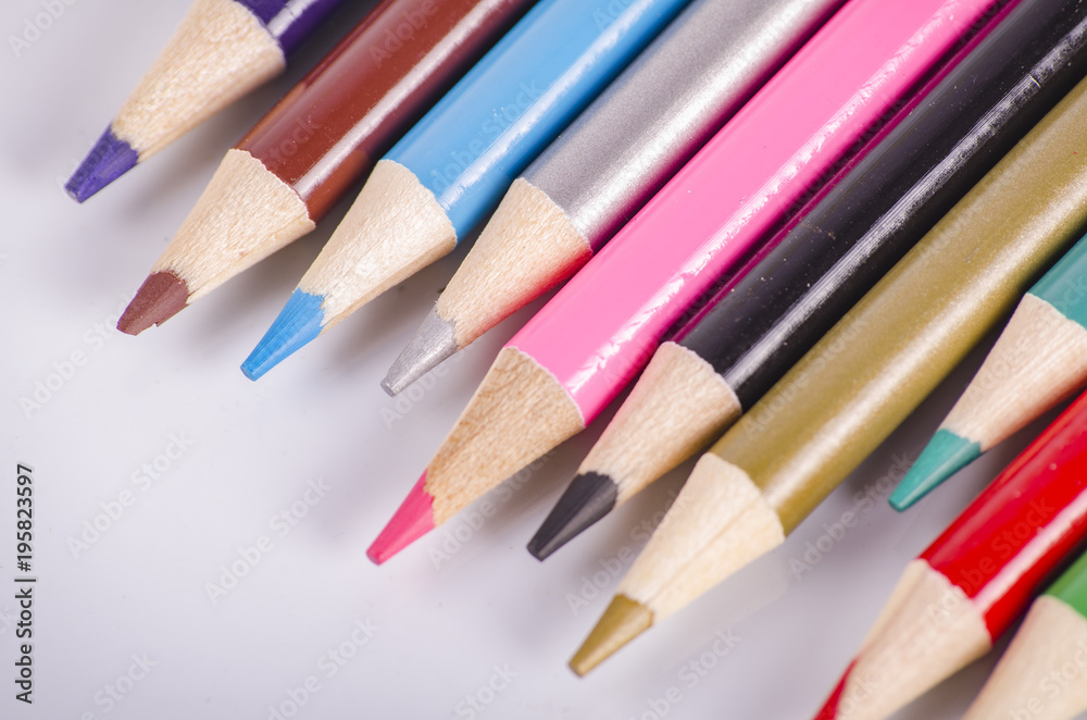 colorful color pencil stacked on white background ideal for back-to-school and education concept