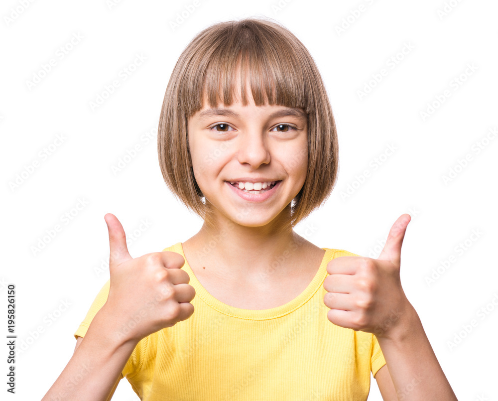 Close-up emotional portrait of caucasian little girl. Funny kid making thumbs up gesture, isolated on white background. Beautiful child laughing looking very happy. Close-up emotional portrait of caucasian little girl. Funny kid making thumbs up gesture, isolated on white background. Beautiful child laughing looking very happy.