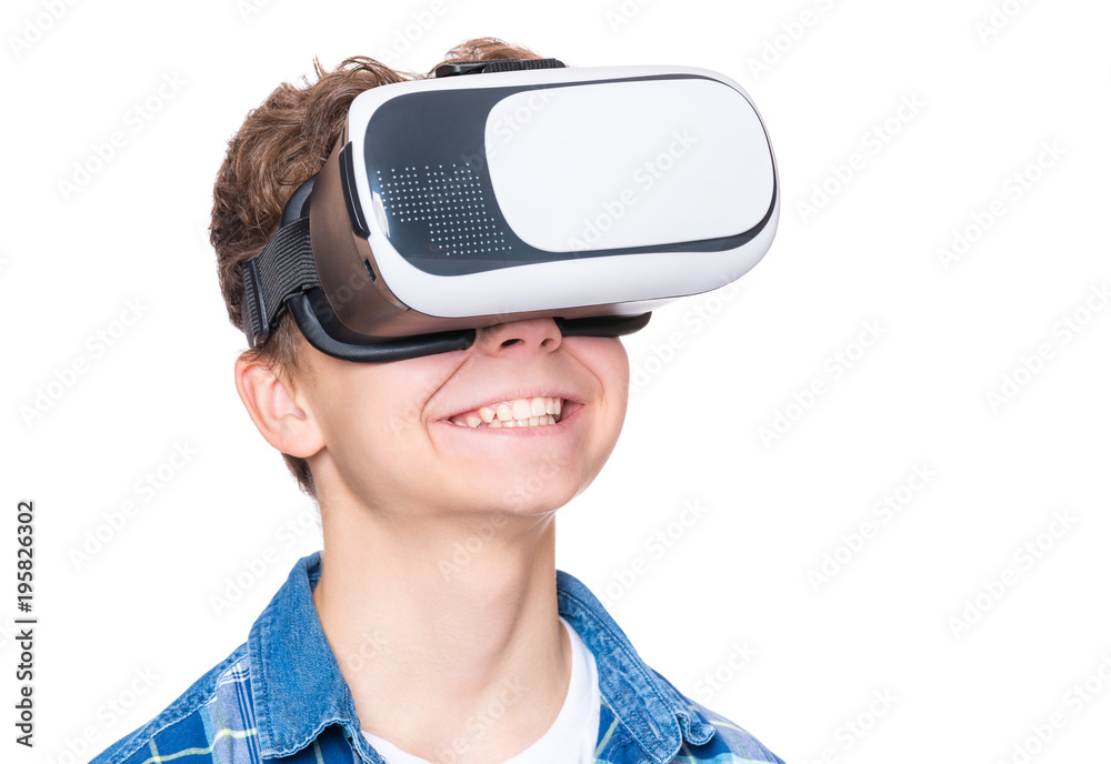 Happy teen boy wearing virtual reality goggles watching movies or playing  video games, isolated on white. Cheerful teenager looking in VR glasses.  Funny child experiencing 3D gadget technology. Stock Photo | Adobe
