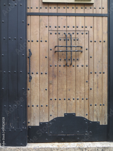 Wooden door with studs