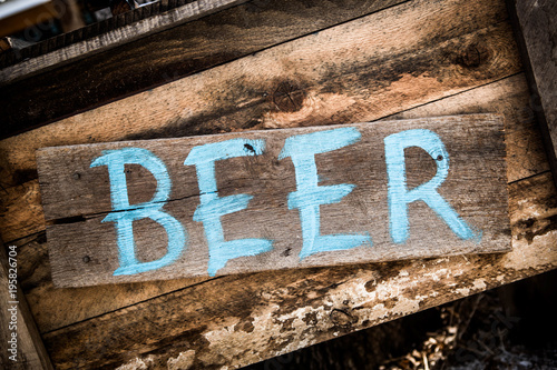 Beer sign on wooden board