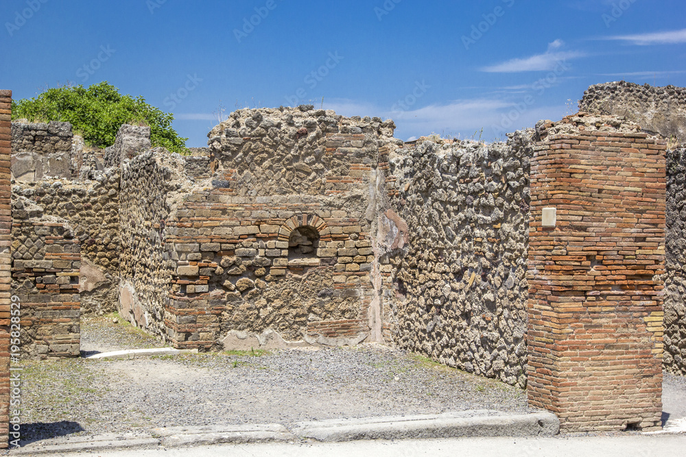 Streets and stone houses of the ruined ancient city of Pompeii, Pompei, Naples, Italy.