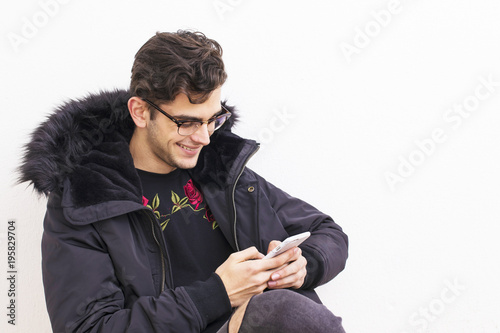 young isolated in white background with mobile phone