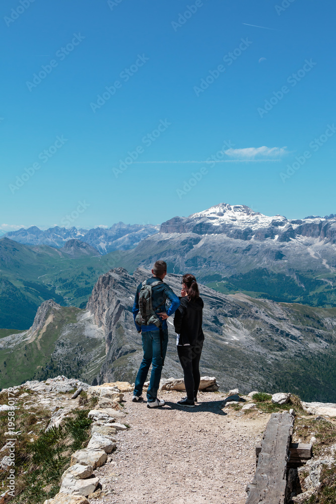 Young Couple Admire Italian Dolomites Alps Scenery